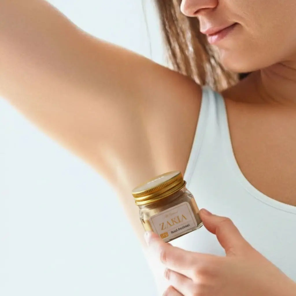 Woman applying Zakia Natural HER Sandalwood Musk deodorant cream to underarm